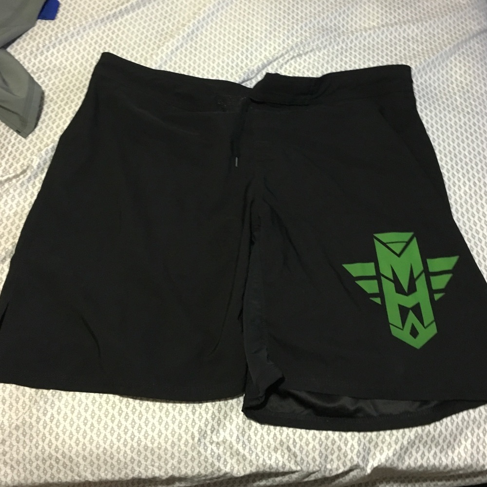 Black and green MMA shorts Most Hated Gear